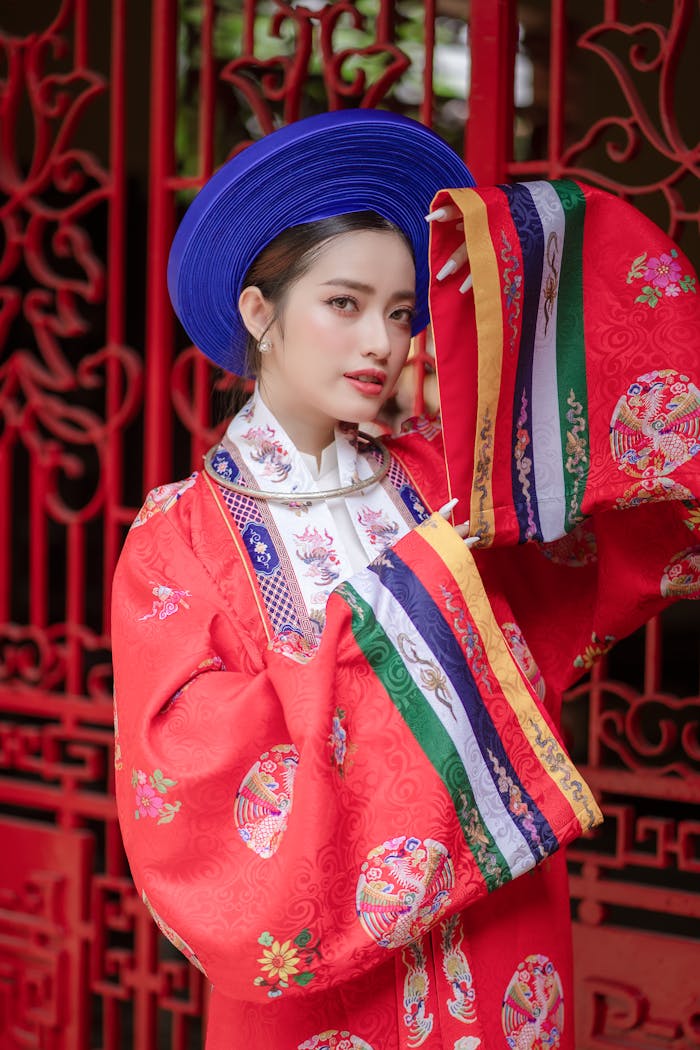 Striking portrait of a woman in colorful traditional clothing with a vibrant headdress.